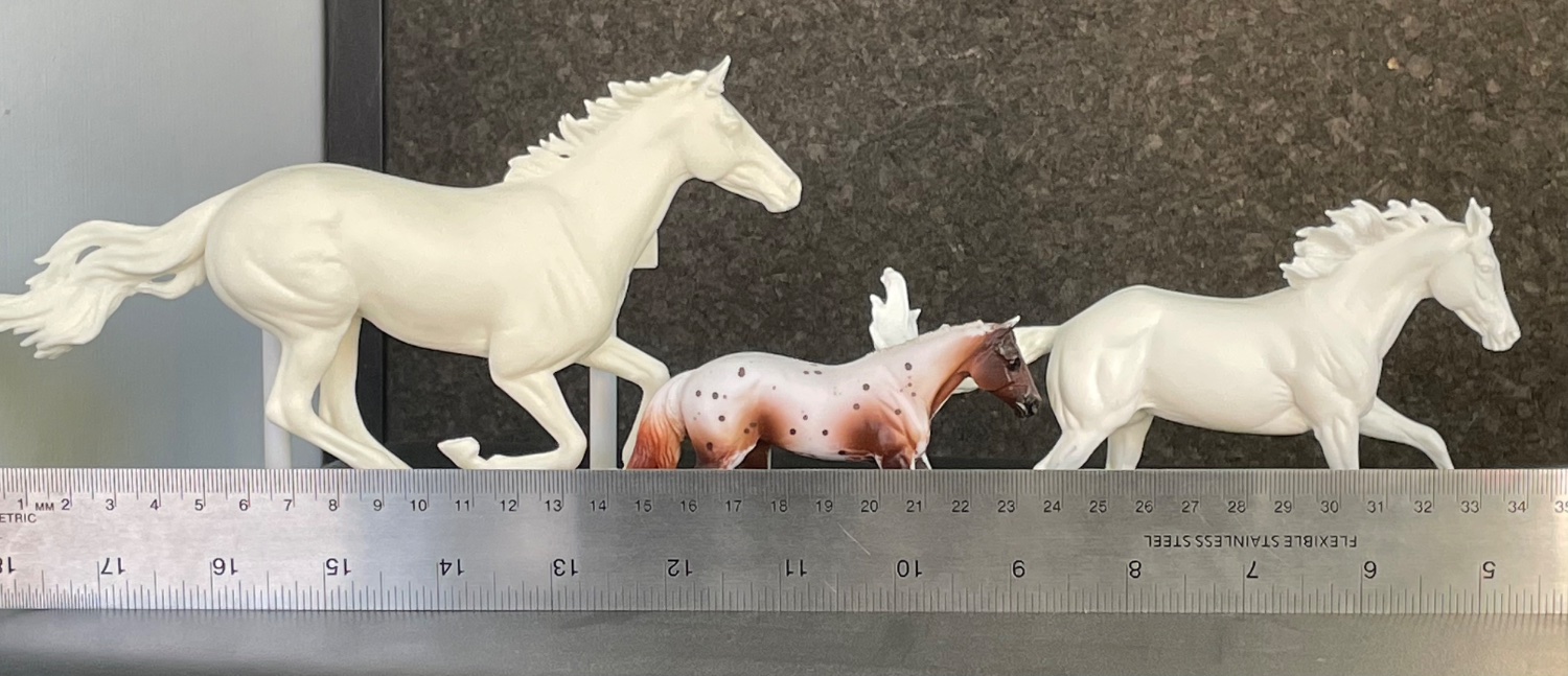 Three mini bodies of different scales, all cantering, next to a ruler. Details in text.